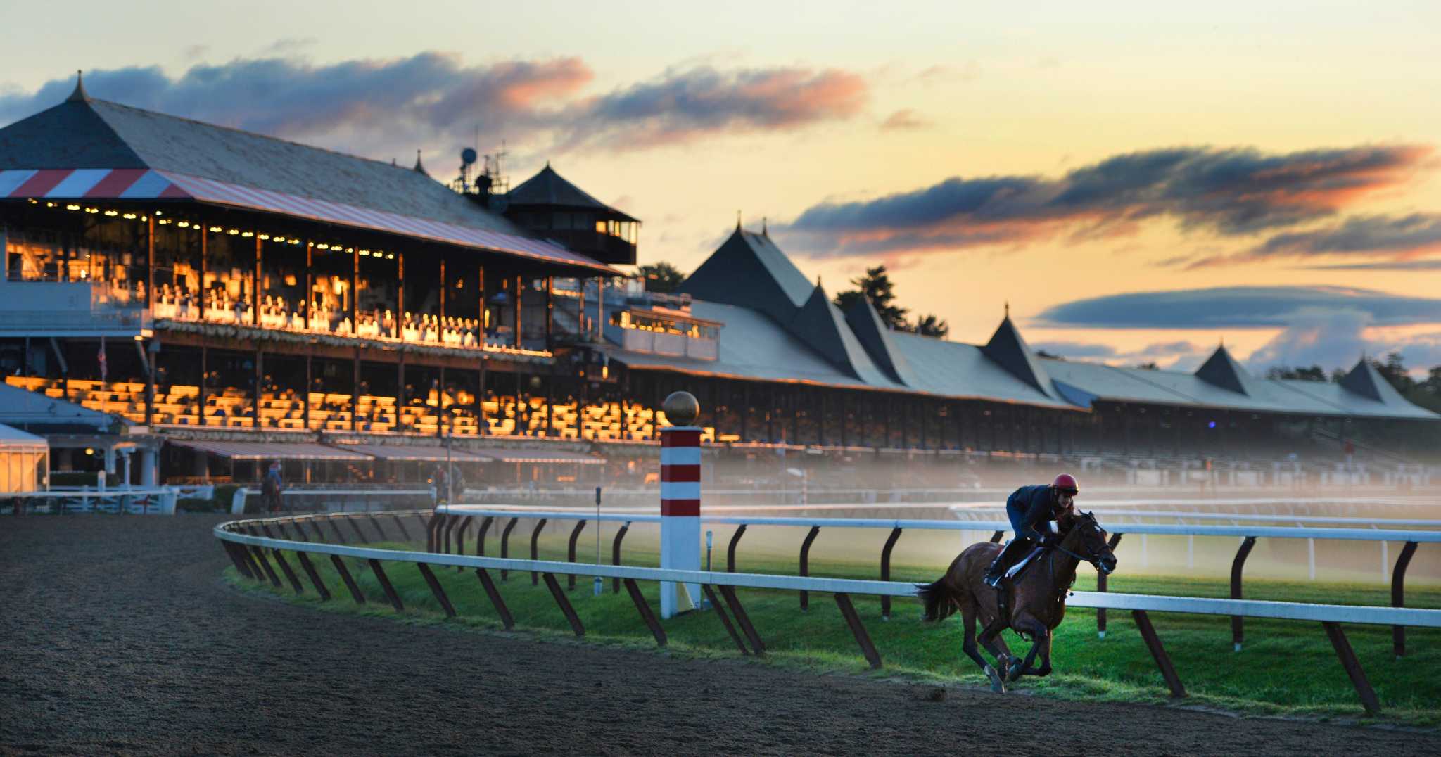 Horse racing at sunset